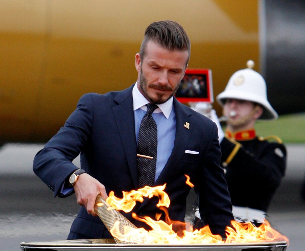 David Beckham na cerimónia de entrega da chama olímpica Foto: Lusa