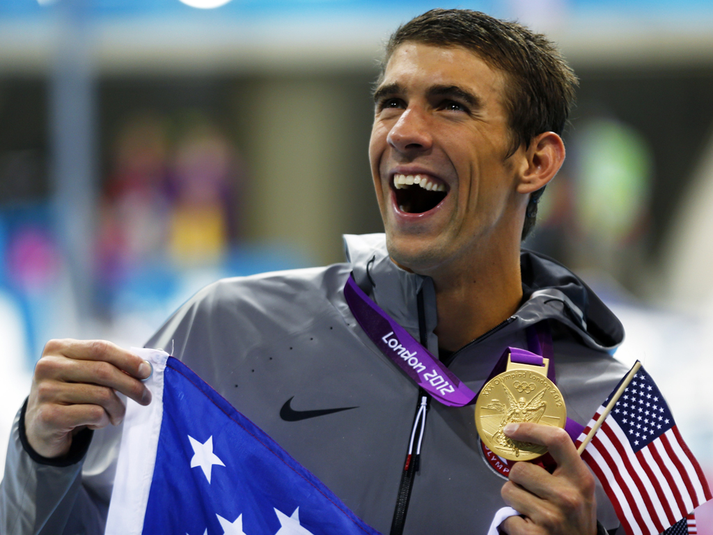 O dia histórico de Michael Phelps ( EPA/DENNIS M. SABANGAN)